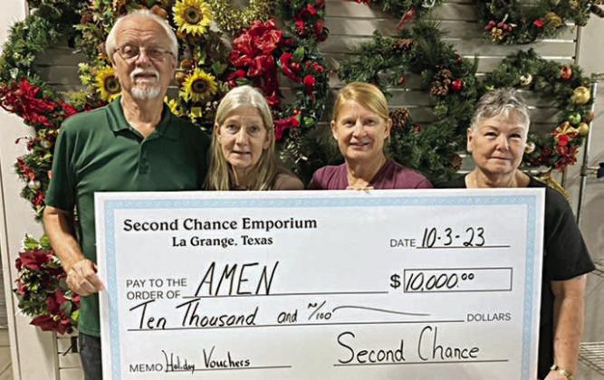 AMEN Food PANTRY – On hand as Second Chance Emporium presented a $10,000 donation to the AMEN food pantry were (from left) Garry Schellberg, AMEN food pantry treasurer; Gayle Schielack, SCE store director; Marlene Schnell, SCE assistant store director; and Darlene Strahan, SCE assistant store director.