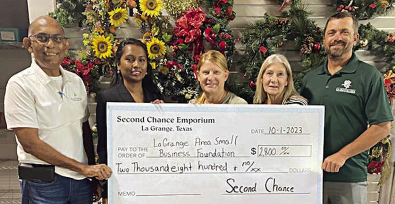 WOMEN’S SMALL BUSINESS SEMINAR – On hand as Second Chance Emporium donated $2,800 to the La Grange Area Small Business Foundation for the National Women’s Small Business Seminar &amp;amp; Workshop were (from left) David Ramjohn, La Grange Area Chamber of Commerce (LGACOC) ambassador; Deokie Ramjohn, LGACOC board chair and foundation director; Marlene Schnell, SCE assistant store director; Gayle Schielack, SCE store director; and Brandon Schielack, LGACOC board member.