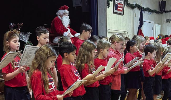The second, third and fourth grade students from St. Rose of Lima Catholic School entertained with music and laughter.