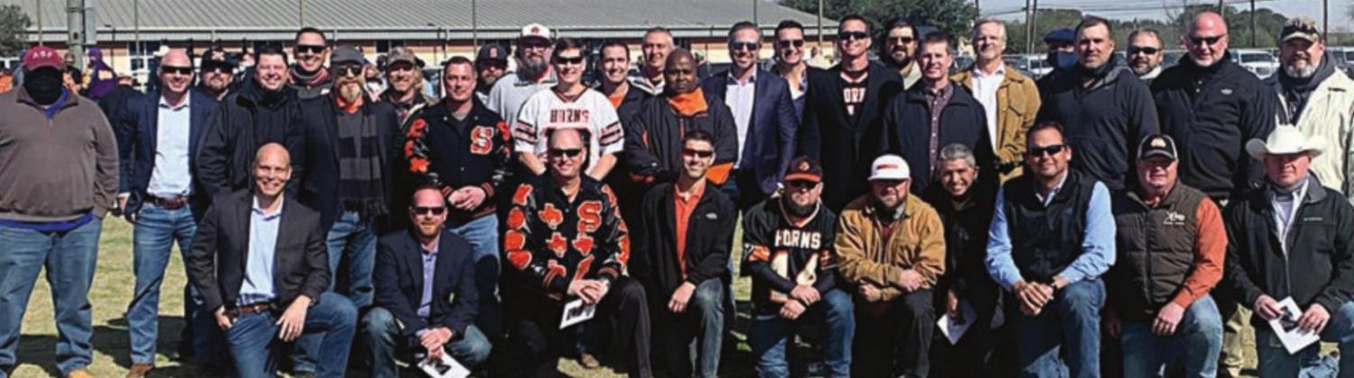 A large group of former Shorthorns came to honor their former coach. Sticker Photo By Darrell Vyvjala