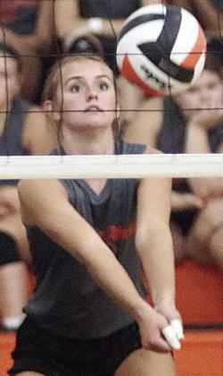 Miranda Bonner sends a pass on its way during a scrimmage. Sticker Photo By Darrell Vyvjala