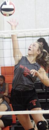Kimber Bartosch goes for a kill during Friday’s scrimmage. Sticker Photo By Darrell Vyvjala