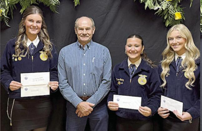 Schulenburg Young Farmers Scholarship – (from left) recipient Madyson Holub; presenter Mark Vecera; recipeints Claire Oeding and Olivia Mathis.