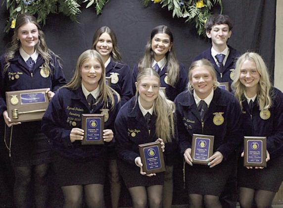 Retiring Officer Team – PHOTO AT LEFT (front row, from left) Kyrroll Prihoda, Kaylee Beyer, Haley Schramek, Keeley Warnken, (back row) Madyson Holub, Morgan Steinhauser, Klare Segura and Colton Knigge,