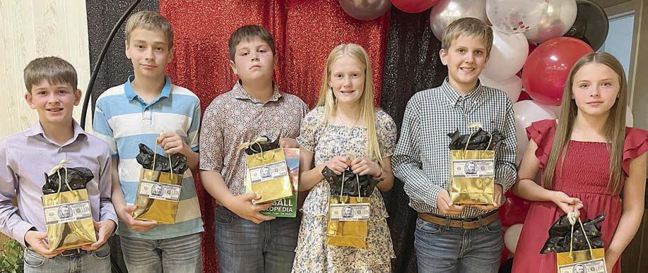 6th Gra de Reading Millionaire’s Club recognition went to (from left) Luke Goedrich, Justin Schramek, John Schmidt, Briley Hartensteiner, Levi Johnson and Kynslee Zapalac.