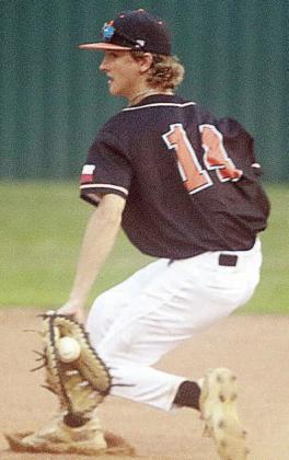 First baseman Connor Lichnovksy backhands an Indian grounder before tossing to pitcher Owen Brenek for an out in the top of the second;.