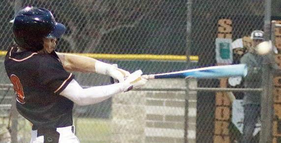 Jayse Janda sends a looping hit over the shortstop for the Horns’ final run in the bottom of the second. Sticker Photos By Darrell Vyvjala