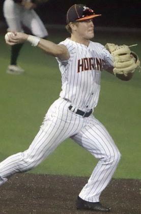 Shortstop Reid Janda pivots after fielding a ground ball to throw to second base for the final out of game two. Sticker Photo By Darrell Vyvjala
