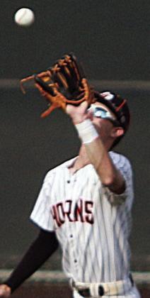 Right fielder Zane Brenek looks in a fly ball in the series opener. Sticker Photo By Darrell Vyvjala