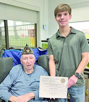 American Legion Post 143 and Auxiliary awarded a $1,000 scholarship to Trevor Janak (right), 2025 graduate of Katy ISD. He plans to attend Texas Tech in the fall. Legion member Nathan Loth (left) presented the scholarship to his grandson.