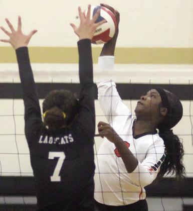 Jessalyn Gipson sends down one of her 11 kills in the regional quarterfinal match. Sticker Photo By Darrell Vyvjala