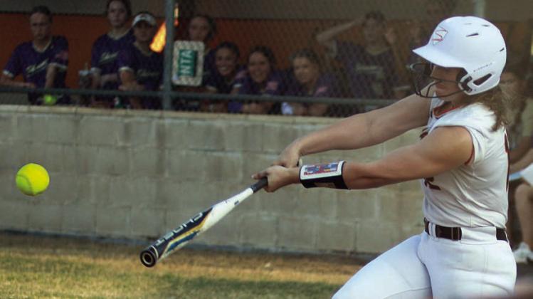 Summer Livingston connects for an RBI-double in the first inning against Shiner. Sticker Photo By Darrell Vyvjala