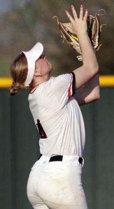 Shortstop Angel Davis secures a Lady Comanche popup. Sticker Photo By Darrell Vyvjala