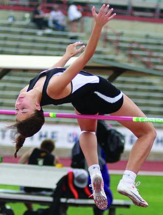 Before her winning jump at 5’5”, Meredith Magliolo comes through in her third and final attempt to clear 5’4”. Sticker Photo By Darrell Vyvjala