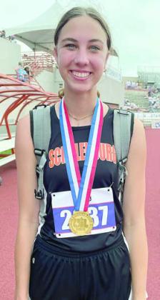 Meredith Magliolo shows off her gold medal. Sticker Photo By Darrell Vyvjala