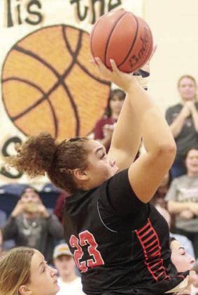 Arianna Vincent scores on a turn-around shot in the fourth quarter. Sticker Photo By Darrell Vyvjala