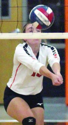Keaton Walker sends a pass on its way in the Lady Horns’ win over Burton. Sticker Photo By Darrell Vyvjala
