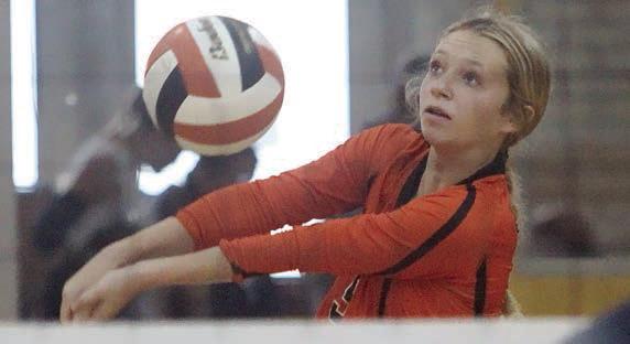 Michaela Kollmann gets a dig in the second set against Goliad. Sticker Photo By Darrell Vyvjala