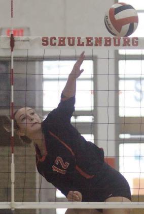 Grace Schramek sends over a kill in the second set of the Gold Bracket semifinal. Sticker Photo By Darrell Vyvjala