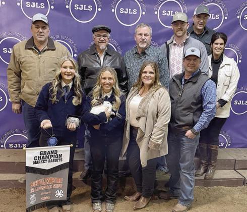 RABBITS – Exhibitor: Annelyse Galipp (front, second from left). Sales price: $5,000. Sticker Photo By Darrell Vyvjala