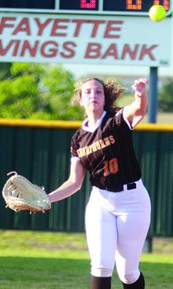 Second baseman Grace Schramek throws to first base for an out against Shiner. Sticker Photo By Darrell Vyvjala