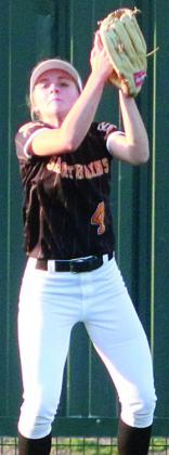 Mallory Bonner secures an out in left field during the Shiner game. Sticker Photo By Darrell Vyvjala