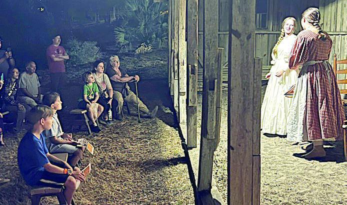 A captivated aud ience watches two Fayette County Community Theatre actors perform a scene during a Memories of Monument Hill tour in 2024.