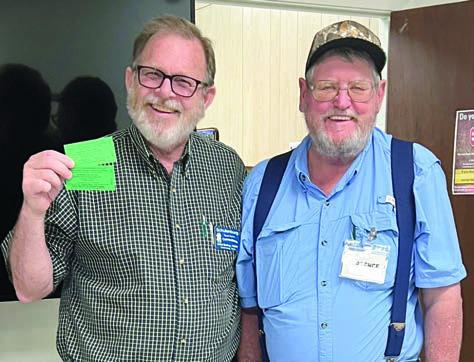 In Shiner blackout bingo , Clarence Ahlschlager (right) won two tickets to the American Legion drive-through dinner, then donated them back, and after another round the winner was Julian Godsey (left). Ahlschlager, a City Alderman, is a Senior Connections member who also serves on the board of directors. Godsey is looking for people who want to dance for fitness in a square/folk dance group.