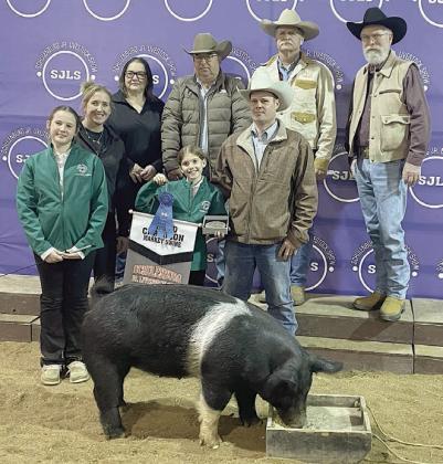 SWINE – Exhibitor: Annaston Kutac (front, left). Sales price: $8,000. Sticker Photo By Darrell Vyvjala