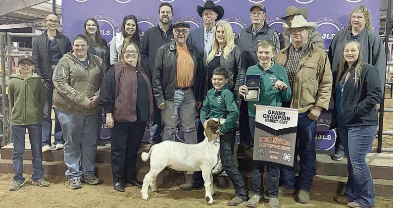 SHEEP – Exhibitor: Hudson Holub (front, left). Sales price: $8,000. Sticker Photo By Darrell Vyvjala