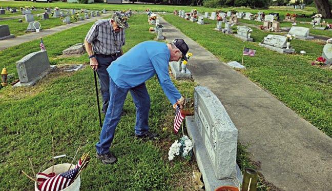Flags placed on veterans’ graves in area cemeteries