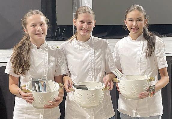 Food Challenge – (from left) Eleanor Carey, Elena Supak and Tori Newton, first in the side dish category and reserve champion team overall advancing to national competition.