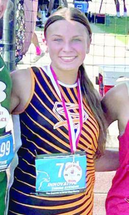 Ellie Hammack receives the second-place medal in the junior varsity girls’ division of the El Campo meet.