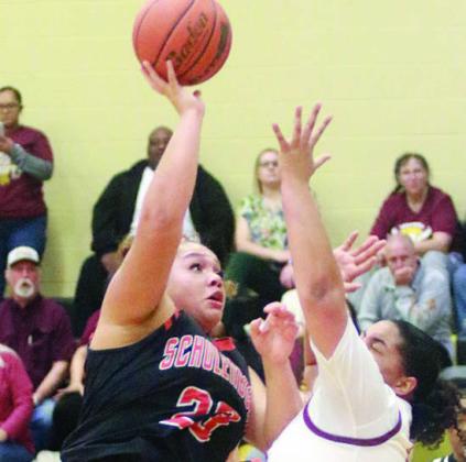 Arianna Vincent hits a shot in the lane in the first quarter. Sticker Photo By Darrell Vyvjala