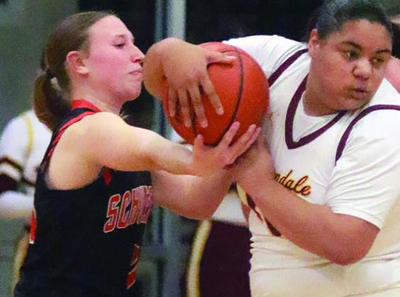 Hope Hammack forces a turnover in the first half. Sticker Photo By Darrell Vyvjala