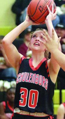 Grace Schramek scores in the third quarter. Sticker Photo By Darrell Vyvjala