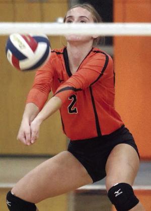 Miranda Bonner digs a Lady Tiger attack in game three. Sticker Photo By Darrell Vyvjala