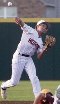 Second baseman Brayden Stoever makes the turn on a double play in game one. Sticker Photo By Darrell Vyvjala
