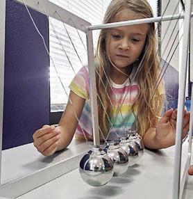 Newton’s Laws of Motion are demonstrated by a “Newton’s Cradle.”