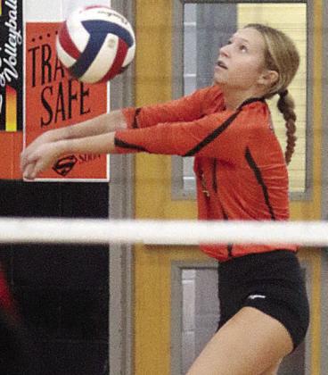 Michaela Kollmann gets to a Burton attack in the back row. Sticker Photo By Darrell Vyvjala