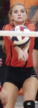 Miranda Bonner picks up a dig in the first set on Friday. Sticker Photo By Darrell Vyvjala