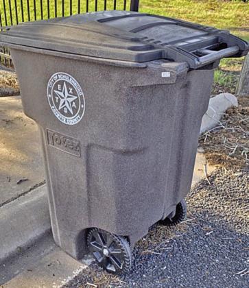 Proper placement of toter – The toter should be on the street in front of the curb with the handle and wheels facing the road.