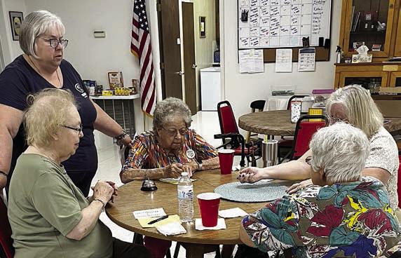 Bunco group, Table 1, on Tuesday, Oct. 24 included (seated at table, from left) Aileen Kasper, Irene Janda, Kitra Ruiz and Cynthia Meyer. Standing at left is Kathy Carpenter, lead volunteer.