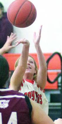 Michaela Kollmann sends a threepointer on its way in the fourth quarter against Ganado. Sticker Photo By Darrell Vyvjala