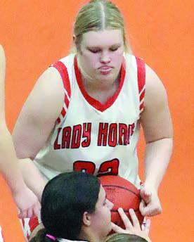 Ava Bubela ties up a Maiden in the fourth quarter. Sticker Photo By Darrell Vyvjala