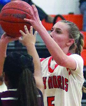 Jenna Guentert hits a jump shot in the lane in the second quarter Friday. Sticker Photo By Darrell Vyvjala