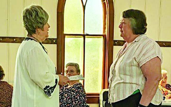 New member Debbie Vallelo (right) was given the Garden Club Oath of Membership by Garden Club president Bonnie Baker (left).