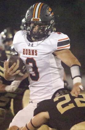 Aaron Janecek finishes off a scramble in the second quarter. Sticker Photo By Layne Vyvjala