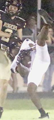 DeMarrion Glass somehow holds on to an interception in the second quarter despite getting his helmet ripped off. Sticker Photo By Layne Vyvjala