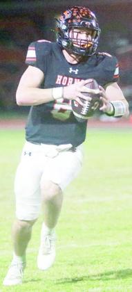 Quarterback Owen Brenek takes off on a 31-yard scramble in the second quarter. Sticker Photo By Brandt Vyvjala